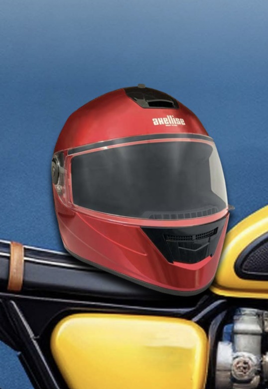 Axellise Unicolour helmet in Sport Red, resting on a classic motorcycle