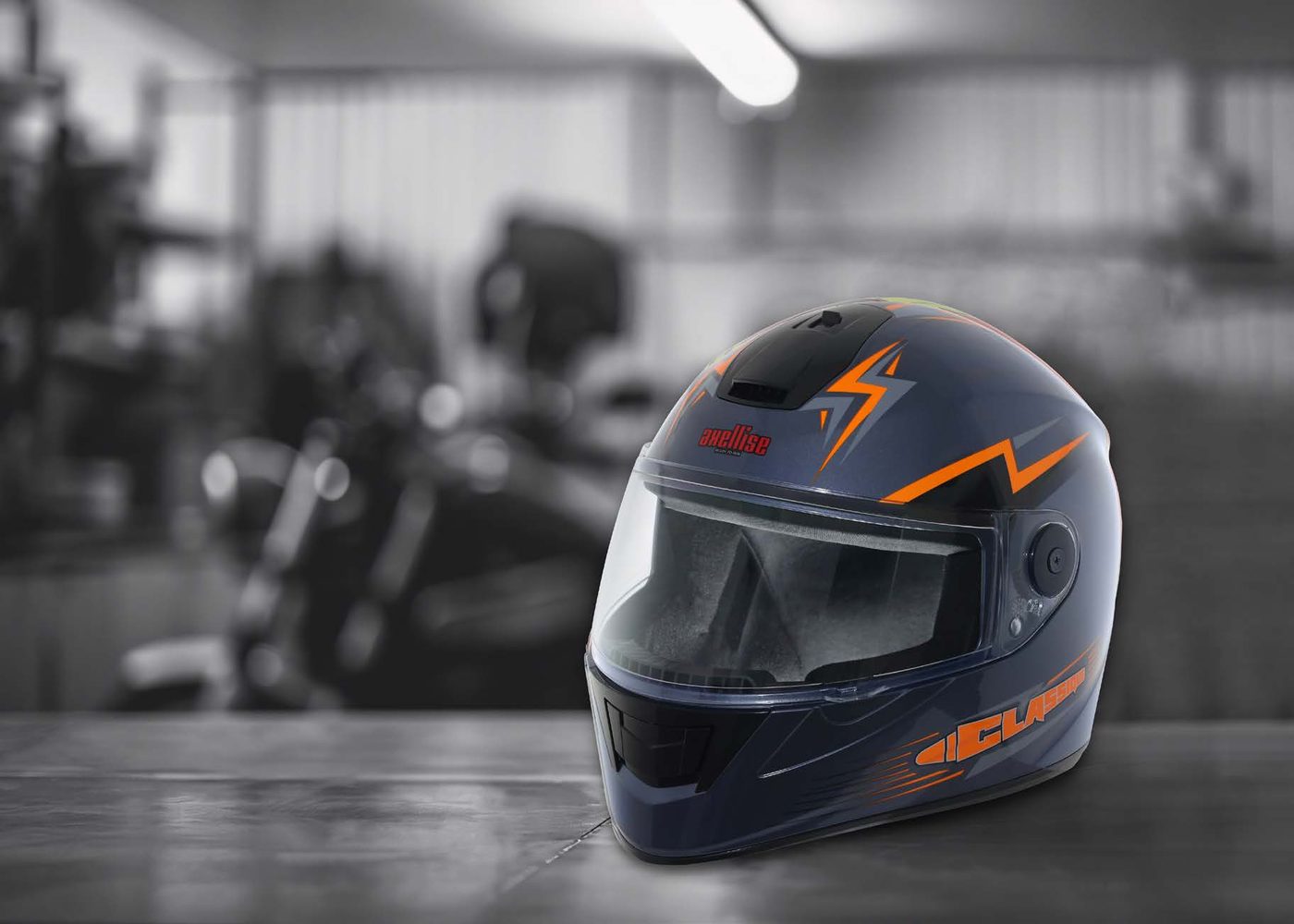 Close-up of an Axellise full face helmet with a lightning bolt graphic